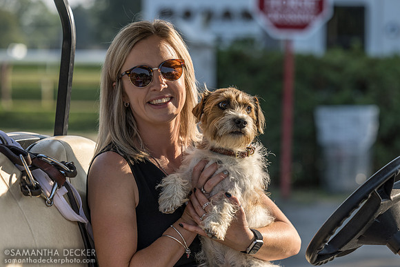Todd Pletcher assistant Sophie Green with dog Jax, all smiles after winning the Jim Dandy