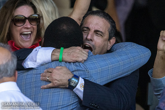 Mike Repole hugs someone