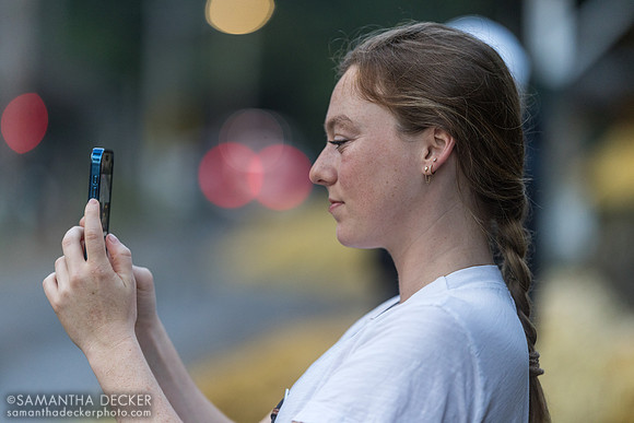 Elinor Wolf, director of marketing and partner relations for Starlight racing, takes a photo of NT