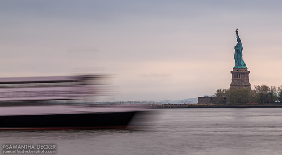 Statue Cruises Heading Past the Statue of Liberty