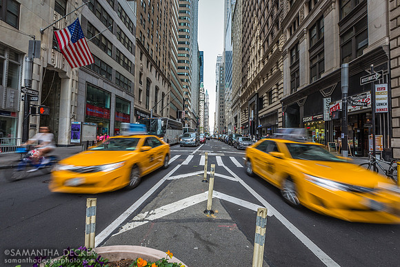 Taxis Zoom By in Downtown Manhattan