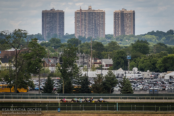Horses go around the backstretch in the Grade III Poker Stakes, Belmont Park, Elmont, NY