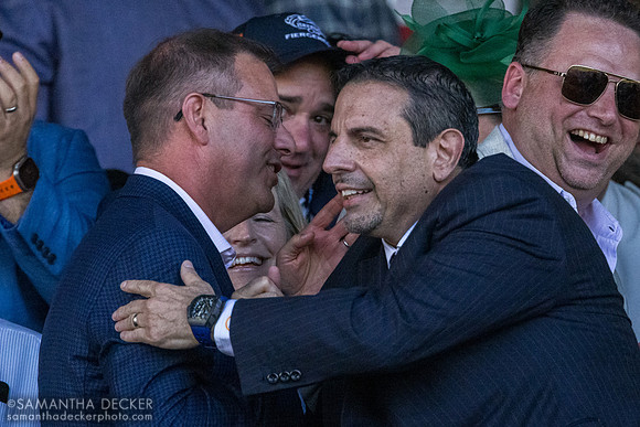 Mike Repole hugs someone