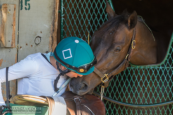 Exercise rider Anna Phillips gives Baby Yoda a kiss 9.19.21