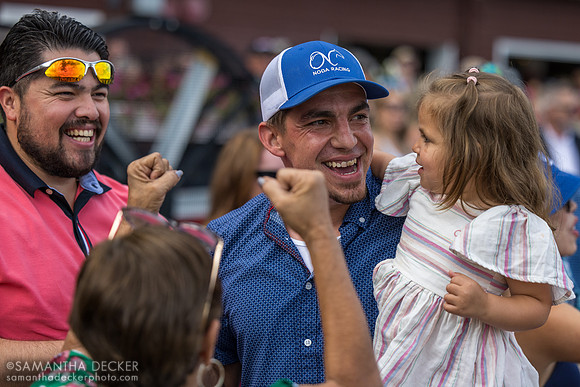 Trainer Orlando Noda celebrates after winning R9