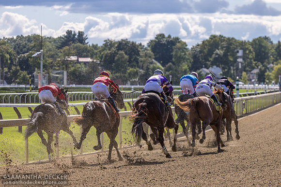 Rounding the far turn in R7