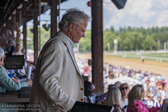 Bill Mott heads to the winner's circle after Reynolds Channel's win
