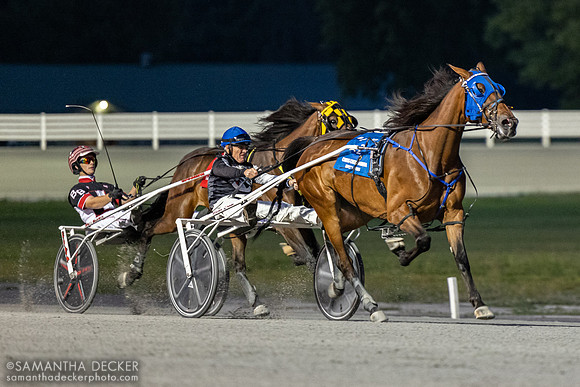 Down the stretch in the sulky race, won by Robbie Davis