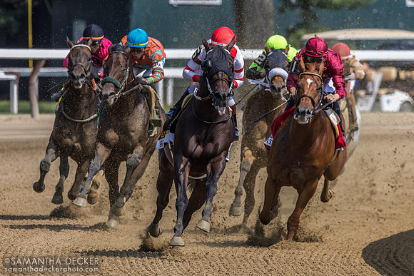 Around the far turn in the AG Vanderbilt H.