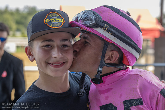Junior Alvarado gives his son Adrian a kiss