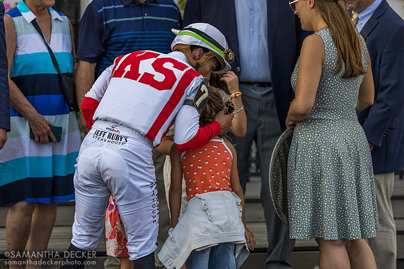 Irad Ortiz hugs his daughters and friends (not sure who)