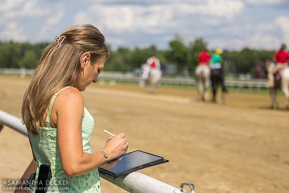 Maggie Wolfendale makes notes on her iPad during the post parade of R7